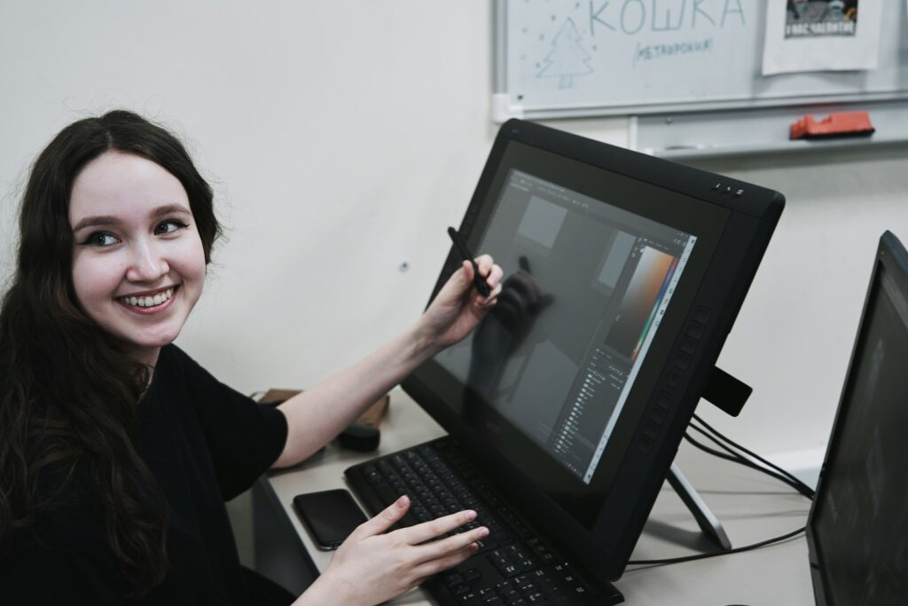 woman in black long sleeve shirt using black laptop computer
